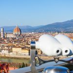 Binoculars on the observation deck in the Piazzale Michelangelo. Florence Italy at sunny day cityscape aerial view.