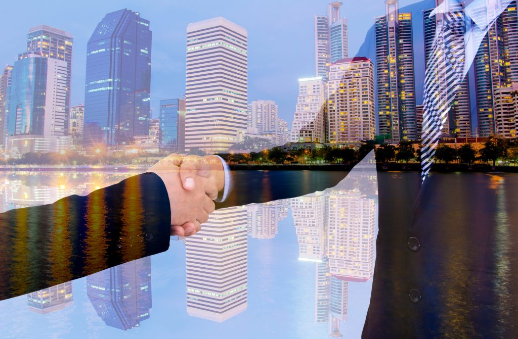 business handshake with city background, Double exposure style