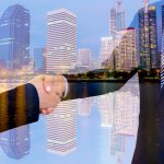 business handshake with city background, Double exposure style